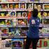 FILE PHOTO: A worker arranges toy boxes inside a Jugettos's toy shop in Madrid