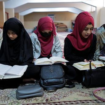 Afghan women learn how to read the Koran at Zainabia madrassa in Kabul