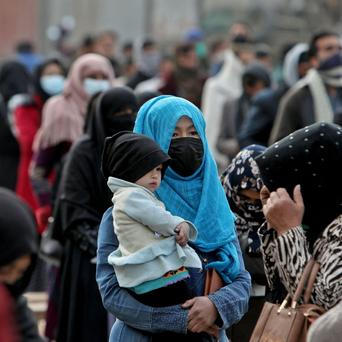 Packages from a Turkish humanitarian aid group distributed amongst Afghans in Kabul