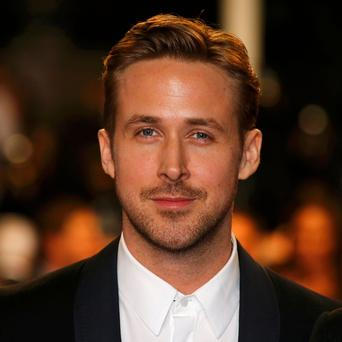 Director Ryan Gosling poses on the red carpet as he arrives for the screening of the film &quot;Lost River&quot; in competition for the category &quot;Un Certain Regard&quot; at the 67th Cannes Film F