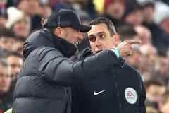 FILE PHOTO: Juergen Klopp remonstrates with fourth official David Coote during Liverpool's Premier League match against Everton