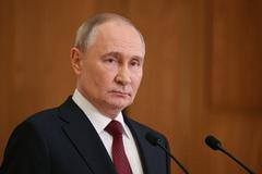 Russian President Putin attends a press conference in Astana