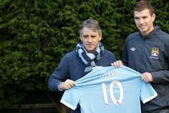 Edin Džeko a Roberto Mancini