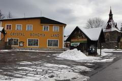 zadlužený Harrachov