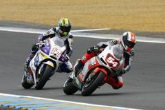 Karel Abraham na Ducati a vedle něj Mattia Pasini na ART