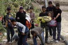 Foto: Jak Syřané prchají přes řeku do Turecka