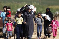 Foto: Jak Syřané prchají přes řeku do Turecka