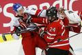 Canada's Dumba battles with Czech Republic's Faksa in front of Canada's goalie Paterson during the third period of their IIHF World Junior Championship ice hockey game in Malmo