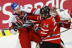 Canada's Dumba battles with Czech Republic's Faksa in front of Canada's goalie Paterson during the third period of their IIHF World Junior Championship ice hockey game in Malmo