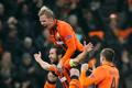 Liga mistrů: Šachtar Doněck - Borussia Dortmund: Darijo Srna slaví gól, Tomáš Hübschmann a Jaroslav Rakitckij (vpravo) - všichni Šachtar
