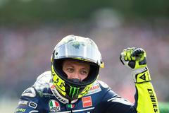 Yamaha MotoGP rider Rossi of Italy celebrates after winning