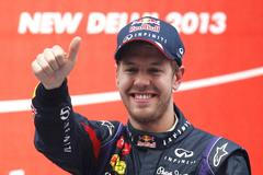 Red Bull Formula One driver Vettel celebrates on the podium after winning the Indian F1 Grand Prix at the Buddh International Circuit in Greater Noida