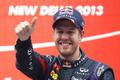 Red Bull Formula One driver Vettel celebrates on the podium after winning the Indian F1 Grand Prix at the Buddh International Circuit in Greater Noida