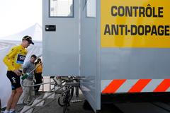 Froome of Britain arrives at the doping control truck after