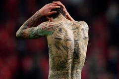 Dánský fotbalista Daniel Agger a jeho tetování