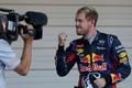 Red Bull Formula One driver Vettel of Germany gestures to a camera after winning the Japanese F1 Grand Prix at the Suzuka circuit