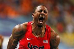 David Oliver slaví vítězství na 110 metrů překážek v Moskvě 2013