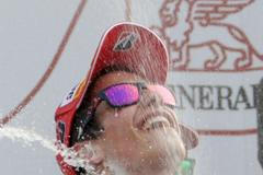 Honda MotoGP rider Spanish Marquez celebrates on podium after becoming the youngest MotoGP world champion at the end of the Valencia Motorcycle Grand Pri in Cheste