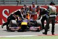 Marshalls remove abandoned car of Red Bull Formula One drive