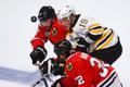 Bruins' Seguin battles for the puck with Chicago Blackhawks'