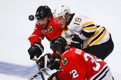 Bruins' Seguin battles for the puck with Chicago Blackhawks'