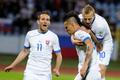 Slovenští fotbalisté Marek Hamšík (uprostřed), Marek Bakoš (vlevo) a Marek Sapara slaví gól v kvalifikaci na MS 2014 proti Lotyšsku.