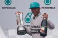 Mercedes Formula One driver Hamilton of Britain celebrates on the podium after winning the Malaysian F1 Grand Prix at Sepang International Circuit outside Kuala Lumpur