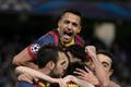 Barcelona players celebrate Lionel Messi's penalty against Manchester City during their Champions League round of 16 first leg soccer match at the Etihad Stadium in Manchester