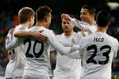 Real Madrid's Jese Rodriguez celebrates scoring against Espanyol with his teammates during their Spanish King's Cup match at Santiago Bernabeu stadium in Madrid