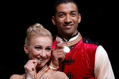 Germany's Savchenko and Szolkowy pose with their gold medals during the presentation ceremony following the pairs free skating program in Saitama