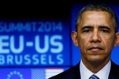 U.S. President Barack Obama looks on as he takes part in a EU-US summit in Brussels