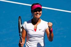 Li Na of China celebrates defeating Lucie Safarova of the Czech Republic during their women's singles match at the Australian Open 2014 tennis tournament in Melbourne