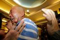 Relatives of passengers aboard Malaysia Airlines MH370 cry after watching a television broadcast of a news conference, in the Lido hotel in Beijing