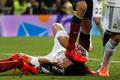 Barcelona's Busquets steps on the face of Real Madrid's Pepe during La Liga's second 'Clasico' soccer match in Madrid