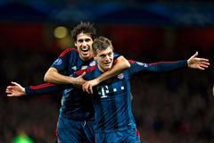Bayern Munich's Kroos celebrates his goal against Arsenal with team mate Martinez during their Champions League round of 16 first leg soccer match at the Emirates Stadium in London