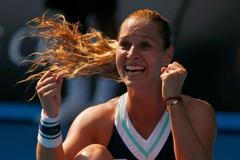 Dominika Cibulkova of Slovakia celebrates defeating Agnieszka Radwanska of Poland in their women's singles semi-final match at the Australian Open 2014 tennis tournament in Melbourne