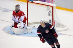 Team USA's Oshie reacts after scoring the game-winning shootout goal against Russia's goalie Bobrovski during their men's preliminary round ice hockey game at the 2014 Sochi Winter Olympics