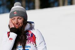 Justyna Kowalczyková se raduje ze zlaté olympijské medaile