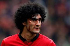 Manchester United's Fellaini bleeds from a head injury during their English Premier League soccer match against Liverpool in Manchester