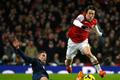Arsenal's Rosicky challenges Manchester United's Van Persie during their English Premier League soccer match at the Emirates stadium in London