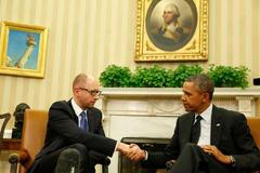 U.S. President Barack Obama shakes hands as he hosts a meeting with Ukraine Prime Minister Arseniy Yatsenyuk in the Oval Office of the White House in Washington