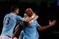 Manchester City's Kompany celebrates with teammates after scoring a goal against Liverpool during their English Premier League soccer match in Manchester