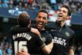 Wigan Athletic's Perch celebrates with teammates McArthur and Gomez after scoring a goal against Manchester City during their English FA Cup quarter final match in Manchester
