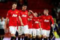 Manchester United players walk off the pitch after losing their English FA Cup soccer match against Swansea City at Old Trafford in Manchester