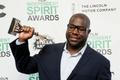 Director Steve McQueen poses backstage with his Best Feature award for the film "12 Years a Slave" at the 2014 Film Independent Spirit Awards in Santa Monica