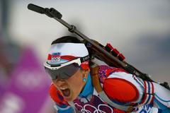 Czech Republic's Vitkova reacts after crossing finish line in women's biathlon 15km individual event at 2014 Sochi Winter Olympics