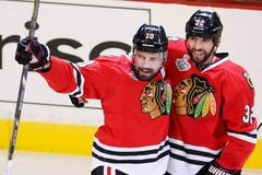Blackhawks' Sharp celebrates his goal against the Bruins wit