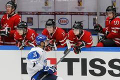 Finland's Teravainen celebrates in front of Canada's bench after scoring on a penalty shot during the third period of their IIHF World Junior Championship ice hockey game in Malmo