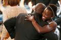Director and producer McQueen celebrates with the Nyong'o after accepting the Oscar for best picture at the 86th Academy Awards in Hollywood