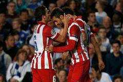 Atletico Madrid's Lopez celebrates with team mate Koke after scoring the first goal for the team during their Champions League semi-final second leg soccer match against Chelsea at Stamford Bridge Sta